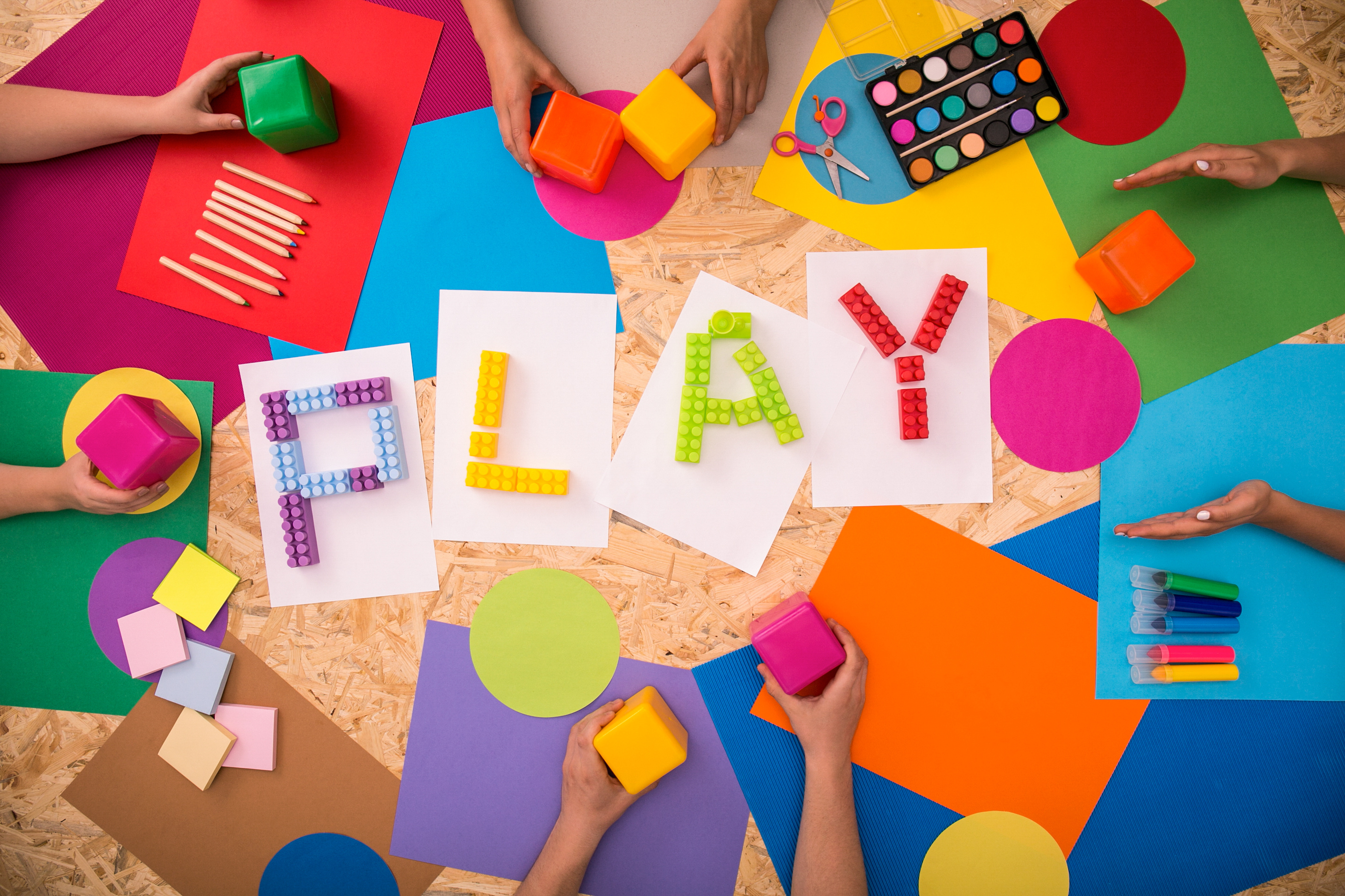 'Play' spelled out in colorful legos
