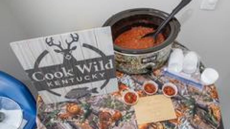 Cook wild sign next to a pot of chili